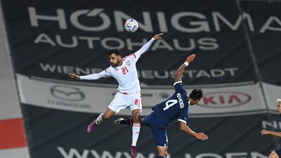 Harib Abdallah and Santiago Arzamendia challenge for a header during the UAE's friendly against Paraguay. Photo: UAE FA