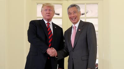 US president Donald Trump and Singapore's prime minister Lee Hsien Loong shake hands during a meeting at the Istana in Singapore. Jonathan Ernst / Reuters