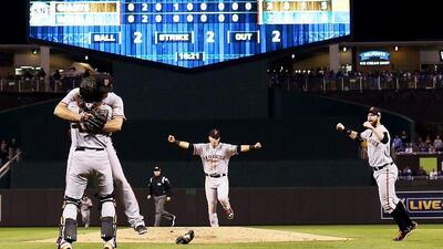 Buster Posey, near, and Madison Bumgarner of the San Francisco Giants celebrate after defeating the Kansas City Royals on Wednesday night to win the World Series. Jamie Squire / Getty Images / AFP / October 29, 2014