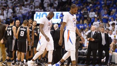 Kevin Durant of the Oklahoma City Thunder walks off the court with teammate Serge Ibaka during their loss to the San Antonio Spurs on Friday night. Larry W Smith / EPA / May 6, 2016