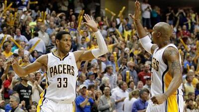 INDIANAPOLIS, IN - MAY 08: Danny Granger #33 of the Indiana Pacers celebrates a late fourth quarter three point basket with David West #21while playing the Orlando Magic in Game Five of the Eastern Conference Quarterfinals during the 2012 NBA Playoffs on May 8, 2012 at Bankers Life Fieldhouse in Indianapolis, Indiana. Indiana won the game 105-87 to to win the series 3-1. NOTE TO USER: User expressly acknowledges and agrees that, by downloading and or using this photograph, User is consenting to the terms and conditions of the Getty Images License Agreement. Gregory Shamus/Getty Images/AFP== FOR NEWSPAPERS, INTERNET, TELCOS & TELEVISION USE ONLY ==