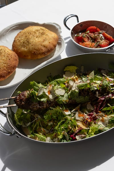 Bisou's lamb kebab is served with black truffle and peppercorn sauce. Photo: Bisou