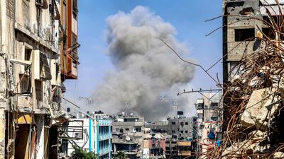 Smoke rises from an Israeli strike amid the ruins of Jabalia in northern Gaza. AFP
