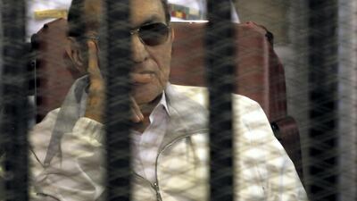 Egypt's ousted President Hosni Mubarak sits inside a dock at the police academy, on the outskirts of Cairo June 8, 2013. Reuters