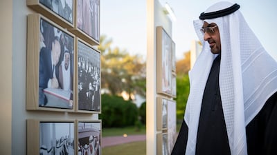 Sheikh Mohamed looks at the December 2, 1971, gallery during an iftar reception at Qasr Al Bahr