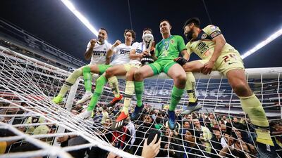 Players of America celebrate with teammates after winning the Torneo Apertura 2018 Liga MX at Azteca Stadium in Mexico City, Mexico. Getty Images