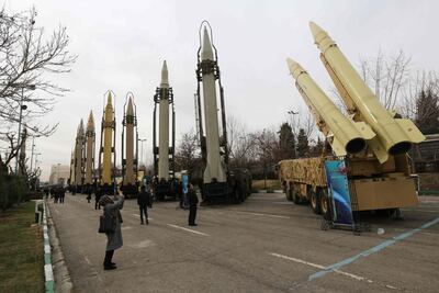 Iranians visiting a weaponry and military equipment exhibition in the capital Tehran, organised on the occasion of the 40th anniversary of the Iranian revolution. AFP