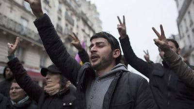 Kurds demonstrate in front of the Centre for Information on Kurdistan in Paris following the murder of three Kurdish women activists in the city.