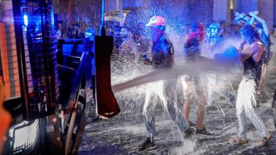 Israeli police spray protesters with water cannon during a rally against Prime Minister Benjamin Netanyahu in Jerusalem. AFP