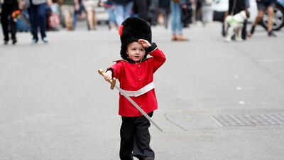 Bruce Pollard, 3, wearing a guardsman's costume, in Windsor, England following the death of Queen Elizabeth II. Reuters
