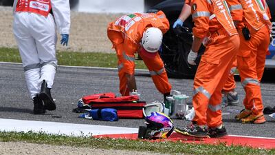 Medical officers clear the track as they evacuate Swiss Moto3 rider Jason Dupasquier in after a crash at the Mugello race track. AFP