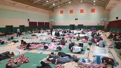 Residents rest at a shelter during a wildfire in Sokcho. Yonhap / AP