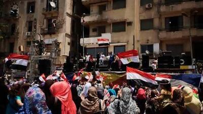Egyptians cheer in Cairo's Tahrir Square after a night of celebrations following the toppling of ousted Egyptian president Mohammed Morsi.