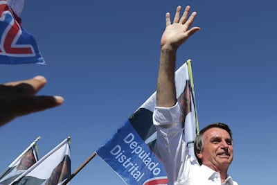 Jair Bolsonaro, National Social Liberal Party presidential candidate, greets supporters during a campaign rally in Brasilia, Brazil. AP