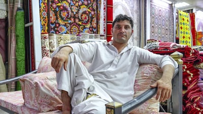 Carpet vendor Ali Ahmad, 25, is originally from Pakistan