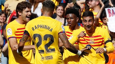 Ferran Torres, right, celebrates after scoring the only goal of the game in Barcelona's La Liga victory over Atletico Madrid at Camp Nou on April 23, 2023. EPA