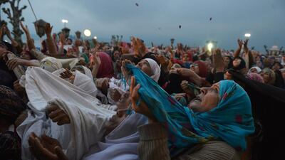 Kashmiri Muslims pray as an unseen custodian displays a holy relic, believed to be a hair from the Prophet Mohammed’s beard, during celebrations for Israa wal Miraj at Kashmir’s main Hazratbal Shrine in Srinagar. Tauseef Mustafa / AFP Photo
