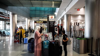 Travellers wait to board flights at Miami International Airport before the long Memorial Day weekend. Global air passenger numbers could rebound from the coronavirus pandemic to top 2019 levels by 2023, the International Air Transport Association predicted on Wednesday. AFP02