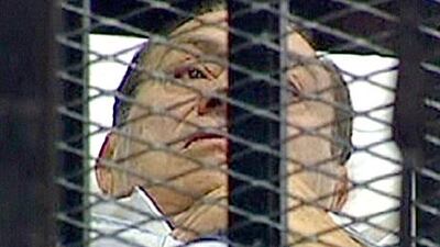 Ashen-faced former Egyptian president denies charges of corruption and complicity in the killing of protesters.