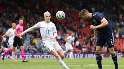 Scotland's defender Stephen O'Donnell heads the ball as Czech Republic's midfielder Jakub Jankto looks on. AFP