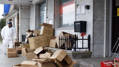 Empty boxes are piled up after community organizers and volunteers with an organization called Bridges distributed donated food items to the many cars in line down the street on the first day of Ramadan. Getty Images via AFP