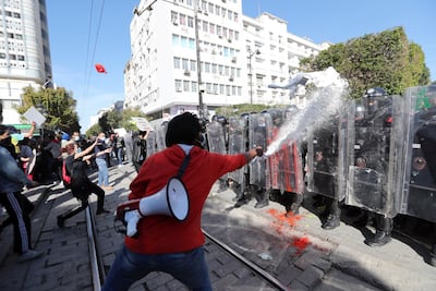 Tunisian protesters clash with anti-riot policemen during a demonstration in Tunis, Tunisia, 30 January 2021. People are protesting the high cost of living, increasing poverty and random arrests in the country. EPA photo