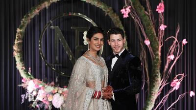 Newlyweds Priyanka Chopra, 36, and Nick Jonas, 26, pose for a photograph during a reception at a hotel in New Delhi on December 4, 2018. Photo: EPA