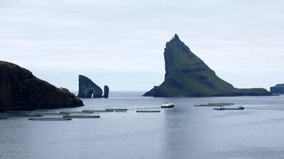 A fish farm in the Sorvagsfjorour fjord on the island of Vagar, one of the Faroe Islands. While there has been little success in finding oil or gas, the islands' economy still flourishes through its rich maritime sector. Pierre-Henry Deshayes/AFP