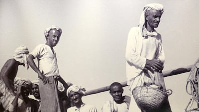 One of the UAE's first major disease outbreaks was in the 18th century in the pearl diving hub of Delma Island. This is an old photograph of the pearl divers on display at the Pearl Museum at Emirates NBD head office in Deira, Dubai. Pawan Singh / The National