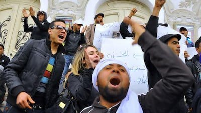 Tunisian protesters demonstrate against their government following the death of an impoverished vendor who torched himself in a street in Tunis.