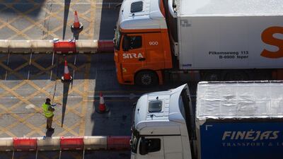A member of the military checks paperwork for lorries at the entrance to the Port of Dover. Goods are moving smoothly and grocery-store shelves are well stocked. Bloomberg