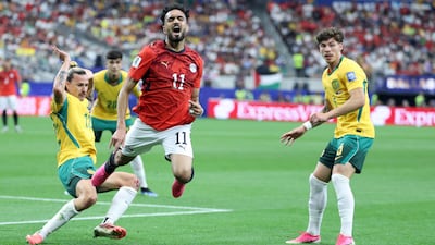 Egyptian midfielder Mostafa Ziko is thrown into the air by a challenge from Australia's Jackson Irvine, left, in Arlington. AFP