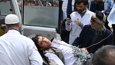 Medical staff move a teenager injured in a bomb attack on boys' school in a Shiite Hazara neighbourhood in Afghanistan's capital Kabul. At least six people were killed. AFP