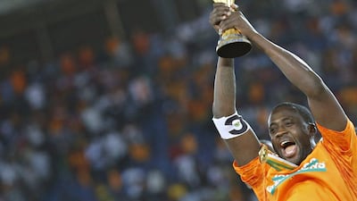Ivory Coast's captain Yaya Toure raises the trophy after winning the Africa Cup of Nations final against Ghana on Sunday. Amr Abdallah Dalsh / Reuters