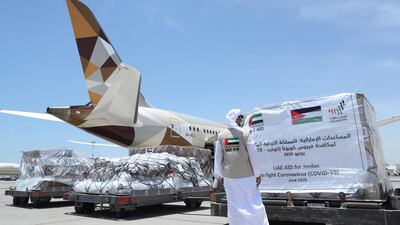 An official checks 12-tonne aid shipment before it is loaded on to an Etihad cargo plane heading for Jordan on June 25. Wam
