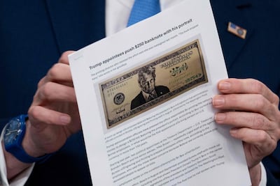 US Secretary of Treasury Scott Bessent shows a proposed $250 bill featuring President Donald Trump. AFP
