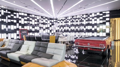 The games room was designed to be a dynamic space, with hidden lighting that can turn it into a nightclub or another cinema with giant projector screens that drop down from the ceiling.