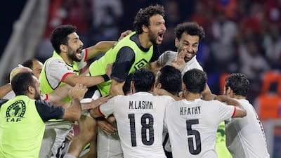 The Pharoahs celebrate after winning a penalty shootout against hosts Cameroon in the Africa Cup of Nations semi-final. AP