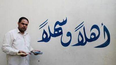 Palestinian Wahid Iqelan, 34, martyrdom/calligraphy artist who works from home in the Shatee refugee camp in Gaza City.nd we will Follow you, Hamas" in the Shatee refugee camp in Gaza City. Naaman Omar / The National