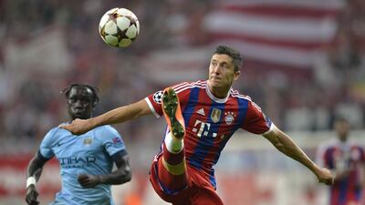 Bayern Munich's Robert Lewandowski lunges at the ball during his side's victory over Manchester City in the Champions League on Wednesday. Guenter Schiffman / AFP