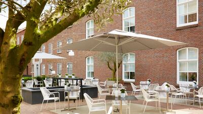 The former prison yard is now lined with olive trees and is home to an organic herb garden. Courtesy Hotel Het Arresthuis