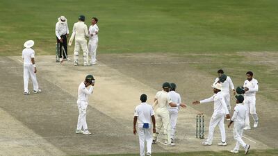 Pakistan and Australia players shake hands after what was a hard-fought Test match in Dubai. Getty Images