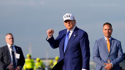 US President Donald Trump arrives at Amsterdam Schiphol Airport for the Nato summit. AP