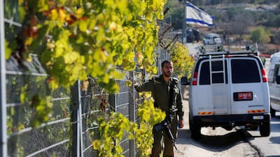 An Israeli soldier stands near the scene where a Palestinian gunman killed three Israelis guards and wounded a fourth in an attack before he was shot dead at a Jewish settlement in the occupied West Bank, September 26, 2017. REUTERS/Ammar Awad