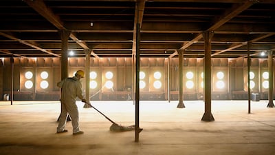 A worker sweeping inside the replica of the world's most infamous cruiseliner, the Titanic.. AFP