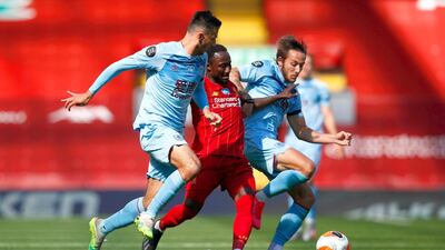Naby Keita of Liverpool and Dwight McNeil of Burnley vie for the ball. Getty