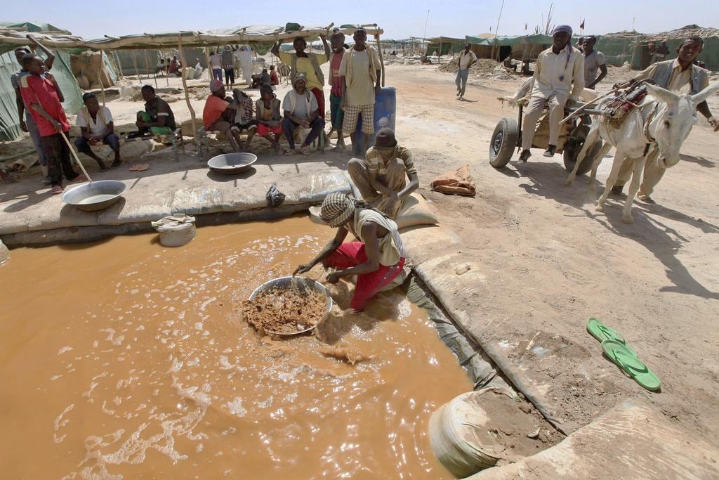 A miner pans for gold at a mine near Abu Delelq in northern Sudan. Reuters
