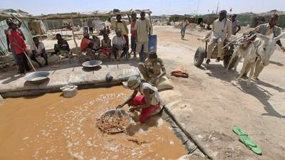 A miner pans for gold at the Wad Bushara gold mine near Abu Delelq in Sudan. About two million artisanal miners are responsible for most of the country's annual gold output. Reuters