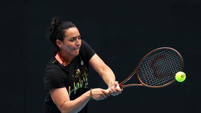 Ons Jabeur plays a backhand during a practice session at Melbourne Park. Getty