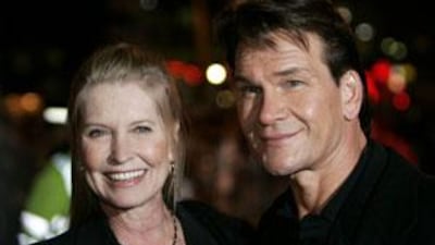 Patrick Swayze and his wife Lisa Niemi pose before attending a film premiere in London in 2005.